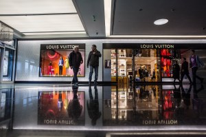 Men and women shop at the Esentai Mall in Almaty, Kazakhstan.