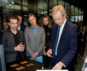 Bernard Arnault and Ian Rogers checking out an exhibit at Station F.