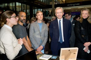 Bernard Arnault, Ian Rogers, and Delphine Arnault checking out an exhibit at Station F.