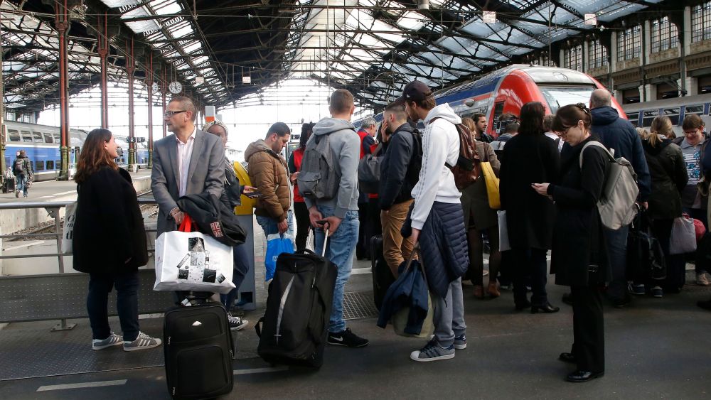 Passengers waiting at Gare de Lyon train station in Paris.