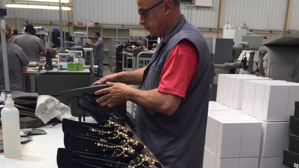 man making shoes