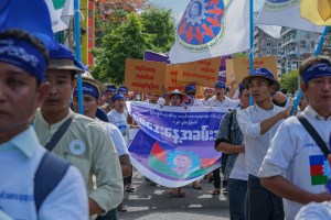 Labors marching and shouting slogans in downtown Yangon on May Day 2018.