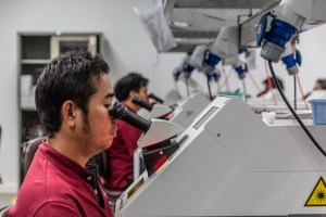Employees use a laser welder.