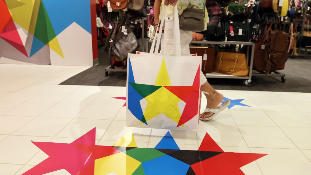 A shopper leaves with a purchase after getting a sneak peek of the Macy's Backstage outlet store within the Macy's department store at Paramus Park in Paramus, N.JMacy's Backstage Opening, Paramus, USA - 08 Sep 2016