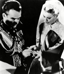 Grace Kelly, Prince Rainier III Prince Rainier III of Monaco, places a ring on the finger of American movie star Grace Kelly of Philadelphia during their wedding ceremony in Monaco Cathedral onPrincess Grace Marriage, Monaco