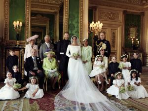 In this photo released by Kensington Palace, shows an official wedding photo of Britain's Prince Harry and Meghan Markle, center, in Windsor Castle, Windsor, England, Saturday May 19, 2018. Others in photo from left, back row, Jasper Dyer, Camilla, Duchess of Cornwall, Prince Charles, Doria Ragland, Prince William; center row, Brian Mulroney, Prince Philip, Queen Elizabeth II, Kate, Duchess of Cambridge, Princess Charlotte, Prince George, Rylan Litt, John Mulroney; front row, Ivy Mulroney, Florence van Cutsem, Zalie Warren, Remi LittBritain Royal Wedding, Windsor, United Kingdom - 21 May 2018