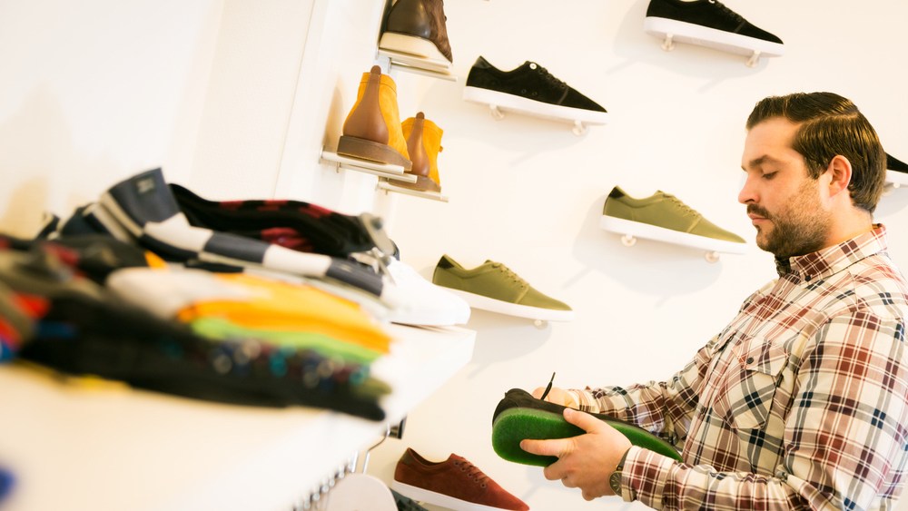 man shopping for shoes