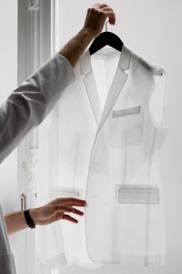 The Dior Homme atelier works on a jacket.