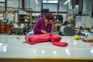 An employee works on a Patagonia jacket at The Renewal Workshop.
