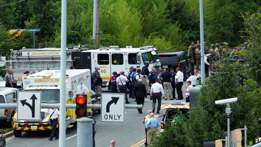 Authorities stage at the building entrance after multiple people were shot at The Capital Gazette newspaper in Annapolis, MdShootings Newspaper, Annapolis, USA - 28 Jun 2018