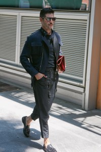 guy walking with bag