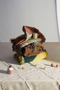From top: Missoni HomeÕs throw; HermsÕ porcelain coffee cup; Bottega Veneta Home Collection's blanket, and Viso ProjectÕs blanket.From left: HermsÕ porcelain cup; Jennifer FisherÕs 10-karat gold-plated and brass rings.