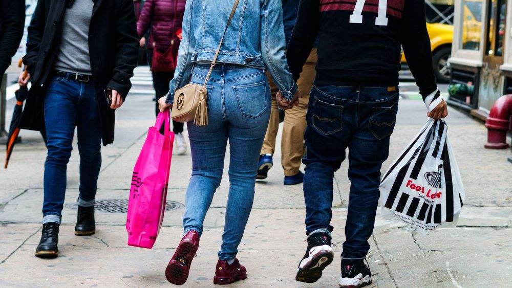 People carry shopping bags in New York, New York, USA, 27 April 2018. The United States Commerce Department's Bureau of Economic Analysis reported today that the US economy grew at an annual rate of 2.3 percent in the first quarter, which is slightly above the average yearly growth rate.US Economic Growth, New York, USA - 27 Apr 2018