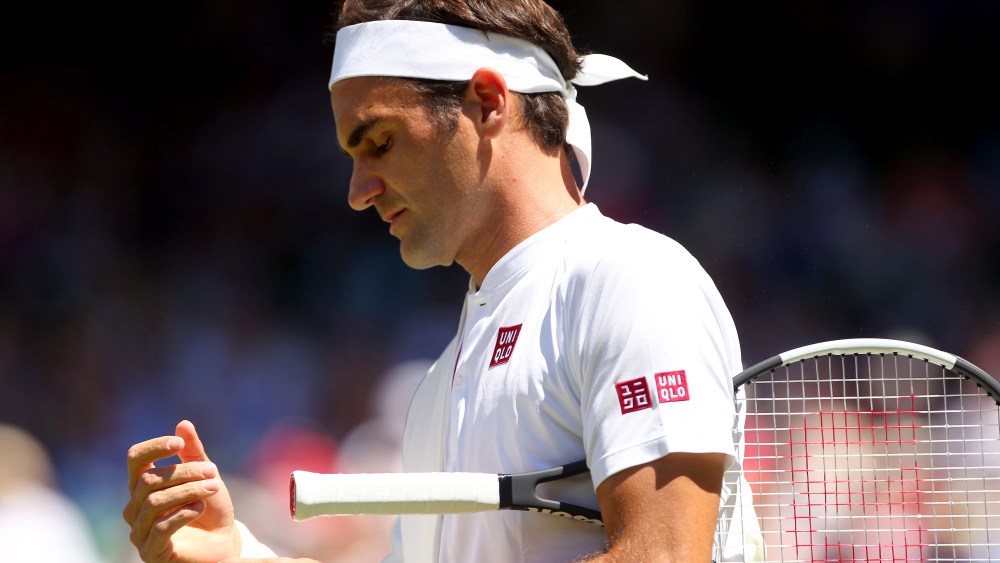 Roger Federer of Switzerland enters court wearing Uniqlo outfitWimbledon Tennis Championships, Day 1, The All England Lawn Tennis and Croquet Club, London, UK - 02 Jul 2018