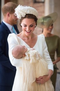 Catherine Duchess of Cambridge carries Prince Louis as they arrive for his christening service at the Chapel Royal, St James's Palace