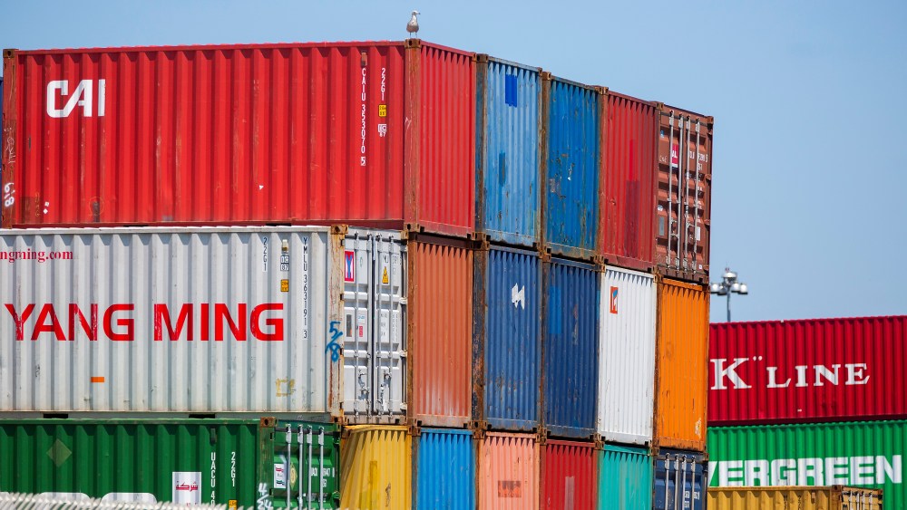 Chinese shipping containers sit at a U.S. dock.