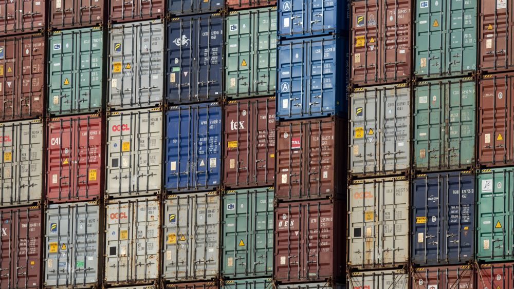 Shipping containers are stacked on the deck of a ship in Kwai Tsing Container Terminals, Hong Kong, 11 July 2018. According to reports, Hong Kong's finance minister Paul Chan said the short-term impact on the city of China's escalating trade war with the United States would be limited to a dip in growth of just 0.1 or 0.2 of a percentage point. According to reports, US President Donald Trump announced on 10 July that US is preparing to impose 10 percent tariffs worth 200 billion US dollars on imported goods from China.A container ships sails the East lamma Channel, Hong Kong, China - 11 Jul 2018