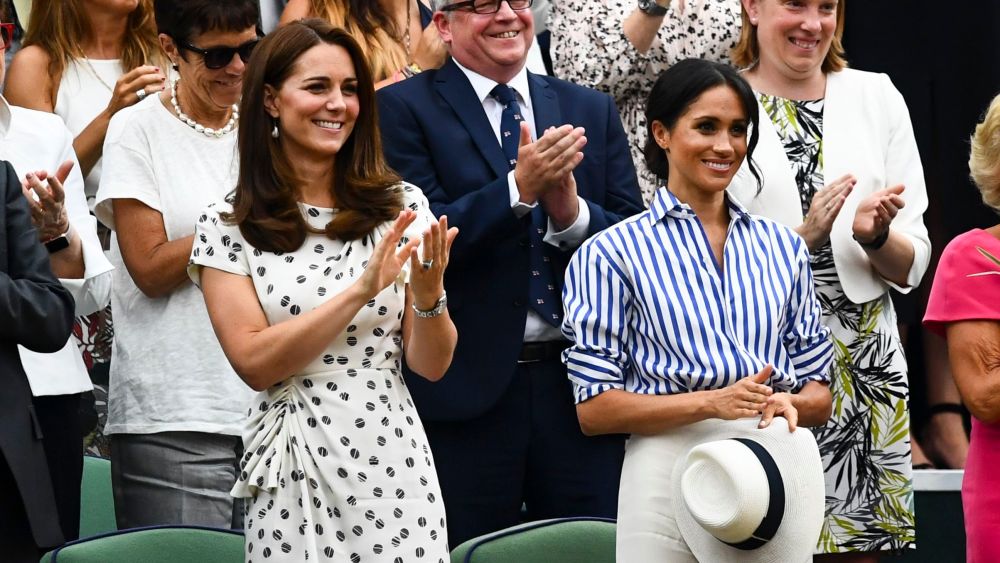 Catherine Duchess of Cambridge and Meghan Duchess of Sussex in the Royal Box at Wimbledon Tennis Championships, Day 12