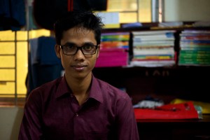 Ayat Ullah, 20, had dreams of becoming a teacher in his hometown of Buthidaung in Myanmar's northern Rakhine State. But after he realized that the military was targeting educated Rohingya, he decided to flee to Chittagong, an industrial city in southern Bangladesh, and sought out work as a garment worker. Ullah sits in his rented home, in front of a desk full of his old school books.