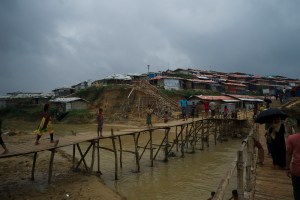 Rohingya refugees cross a bridge in a camp in Cox's Bazar, southern Bangladeshi. More than 700,000 Rohingya have fled Myanmar since August 2017, when the military started cracking down on this ethnic minority group. They have faced widespread persecution in Myanmar for decades.