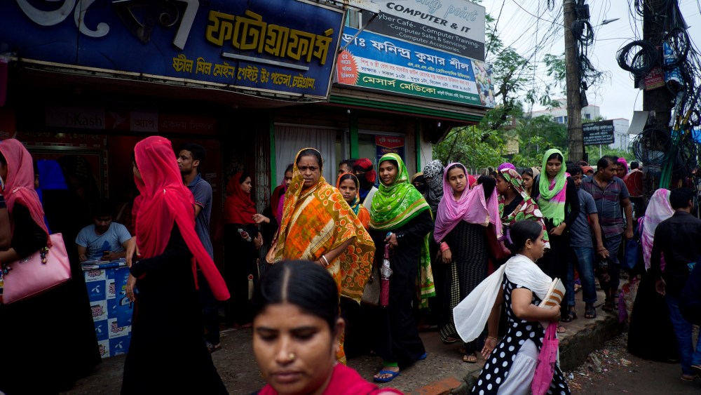 Masses of women leave their factories at the end of the day in Chittagong, southern Bangladesh. This region has more than 500,000 people employed in its garment sector.