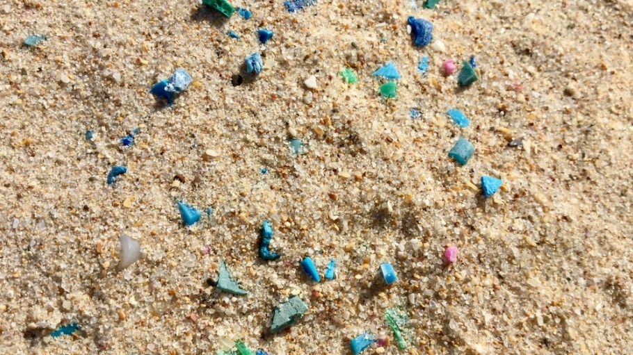 microfibers scattered in sand on beach