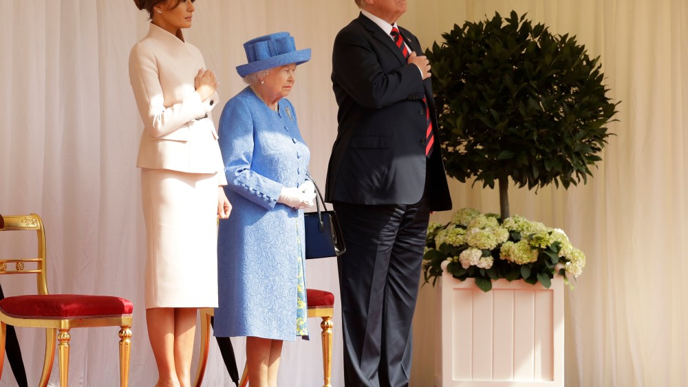 U.S. President Donald Trump and first lady Melania Trump stand with Britain's Queen Elizabeth II on the dais in the Quadrangle of Windsor Castle in Windsor, EnglandBritain Trump Visit, Windsor, United Kingdom - 13 Jul 2018