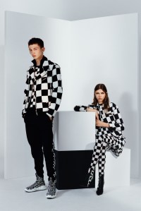 Versus is playing the game of opposites for its fall ad campaign. The studio pictures portray couples of models sporting the brandÕs black-and-white checkered outfits from the fall collection against backdrops in the same pattern and painted cubic props. The opposition between the ÒAnatomiaÓ sock sneakers on male models and logoed high-heeled boots on females further enhance the idea of contrast and the brandÕs unconventional attitude. The pictures were lensed by South Korean photographer Hanna Moon and styled by Allegra Versace Beck. Ñ Martino Carrera