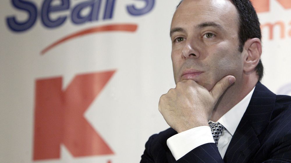 Kmart chairman Edward Lampert listens during a news conference to announce the merger of Kmart and Sears in New York . Kmart is acquiring Sears, one of the most venerable names in U.S. retailing, in a surprise $11 billion deal that will create the nation's third-largest retailerKMART SEARS MERGER, NEW YORK, USA