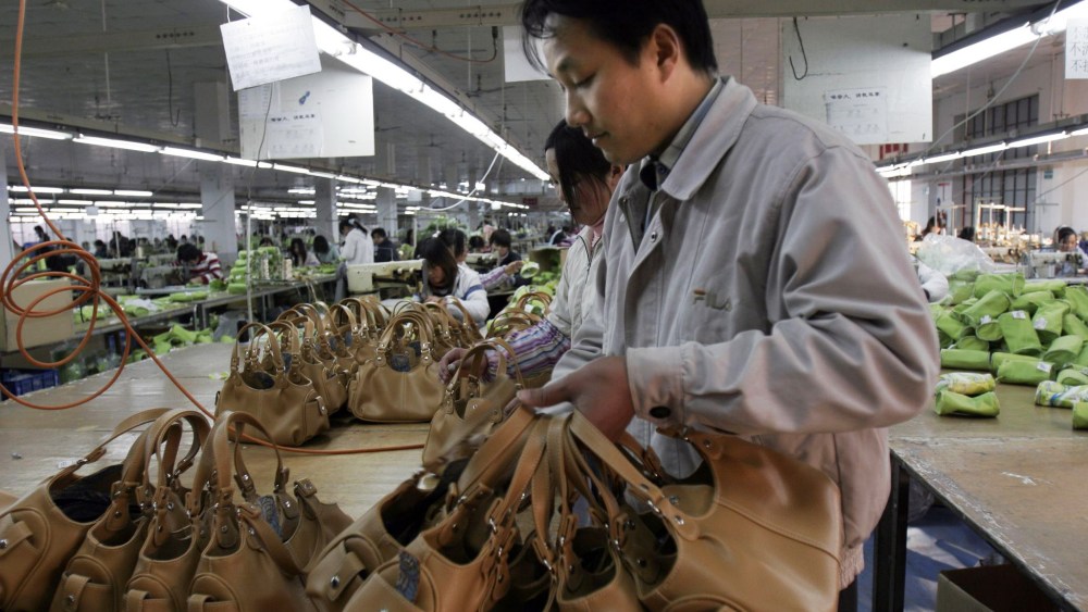 Workers On the Assembly Line at a Handbag Factory in Shanghai China 21 September 2009 Export Oriented Manufacturers in China Are Again Having Trouble Finding Adequate Numbers of Skilled Labor As Christmas Season Orders Pick Up Despite This However Chinese President Hu Jintao Said Recently That China Still Faces an 'Arduous' Task of Maintaining Growth and Social StabilityChina Factory Labor - Sep 2009