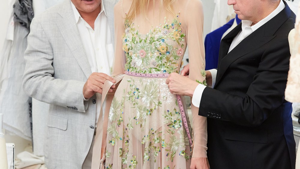 Mark Badgley and James Mischka with a model in their spring collection.