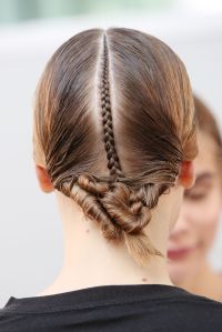 ÒThe inspiration for this seasonÕs hair is a sort of woman who's traveled a lot, [adding] quite an ethnic feeling to the hair. SheÕs traveled to India,Ó said Paul Hanlon. ÒItÕs quite controlled hair, very, very tight. WeÕre using a lot of water in the hair to make it feel like she has sweat a lot. ThereÕs just this little detail in the back, of a little braid that opens up into thisÉ almost undone kind of braided knot at the back. So itÕs quite eclectic. ThereÕs a bit of a Bollywood feel to it, as well. ItÕs very simple but quite strict, as well, at the same time.Ó Ñ Jennifer Weil