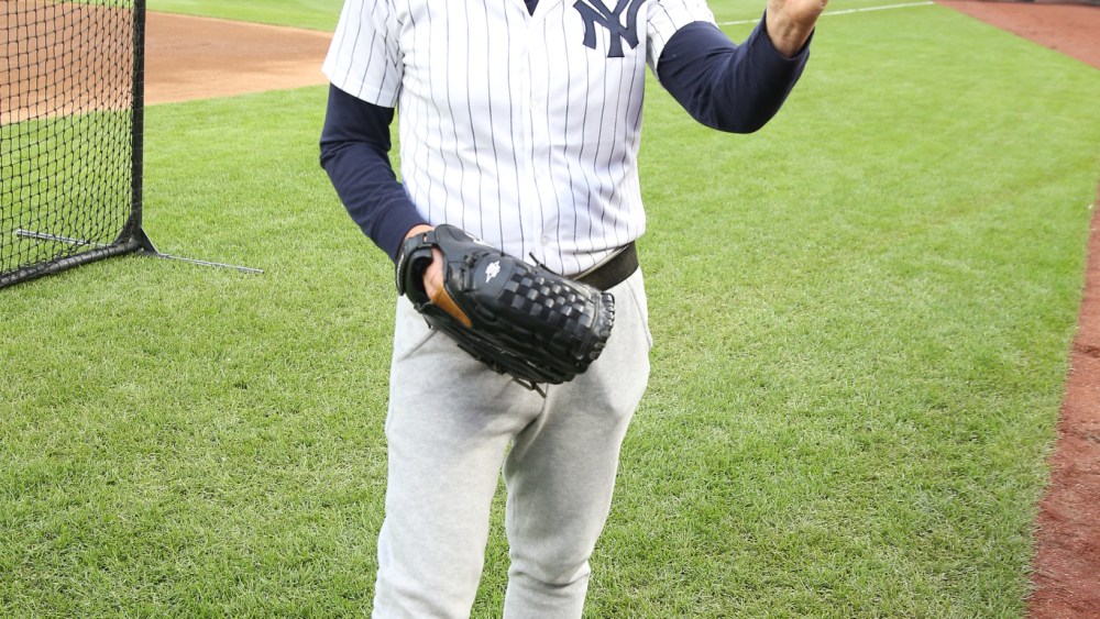 Ralph Lauren throws the opening pitch of the New York Yankees vs Boston Red Sox game in celebration of Ralph Lauren 50th anniversary.