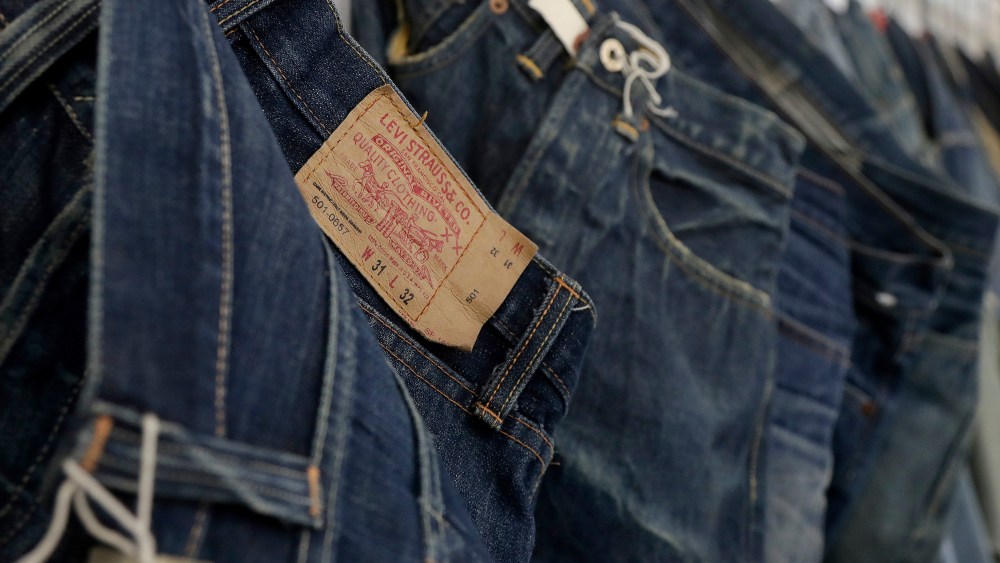 This photo shows Levi's jeans hanging on a wall at Levi's innovation lab in San Francisco. The process of making and selling an item of clothing is speeding up, as shoppers want products faster and faster in the age of Amazon. Companies like Tommy Hilfiger and Levi Strauss are digitizing different steps, like creating digital showrooms for buyers who place orders based on computerized rendering of a garment or producing 3D samples that are emailed to factories, instead of waiting for a physical prototypeDigital Fashion, San Francisco, USA - 09 Feb 2018
