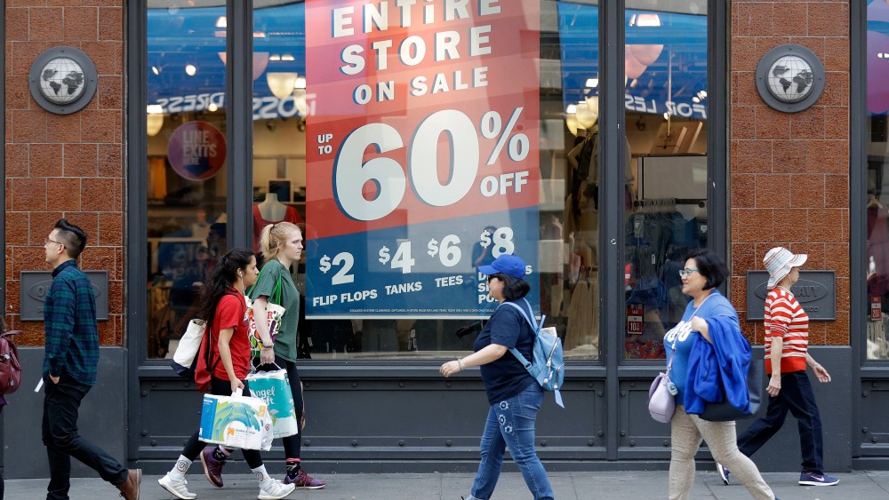 Shoppers walk past sale signs in San Francisco. On Wednesday, Aug 15, the Commerce Department releases U.S. retail sales data for JulyRetail Sales, San Francisco, USA - 03 Jul 2018