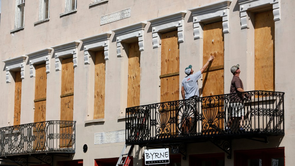 Derek Mundy, left, and Kris Crouse boards up the Confederate House in preparation for Hurricane Florence in downtown Charleston, S.CTropical Weather South Carolina, Charleston, USA - 11 Sep 2018