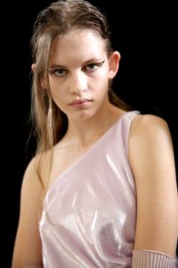 ÒItÕs about creating a cool girl,Ó said makeup artist Lynsey Alexander, backstage at Rochas. ÒWe wanted to make a statement. WeÕreÉ[creating] this kind of fierce toughness in the face. I didnÕt want anything too traditional or Fifties, so itÕs quite a modern, graphic line,Ó she continued, referring to the design drawn on outer corners of modelsÕ eyes. ÒItÕs very straight, and you can see itÕs kind of sharpied on. ItÕs not too painfully painted on. And itÕs disconnected Ñ not a complete line. Skin is very raw and shiny. ThereÕs no mascara, no lipstick. ItÕs all about gorgeous, wet dewy skin with this graphic, disconnected line.Ó Alexander said Rochas artistic director Alessandro DellÕAcqua Òwanted something fresh, something modern Ñ that wasnÕt too traditional in the sense of it being glam-rock or anything like that. He wanted just something quite strong and tough.Ó Ñ Jennifer Weil