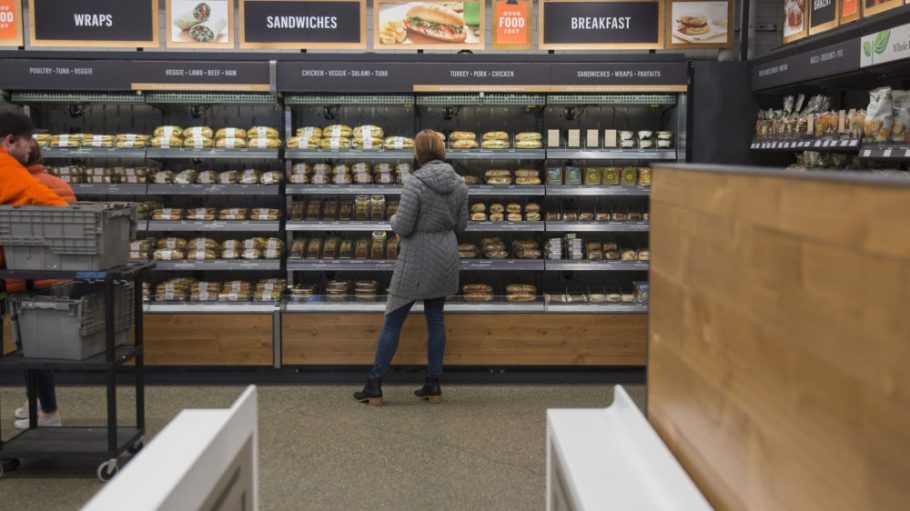 An Amazon.com Inc. employee shops for prepared food at the Amazon Go store