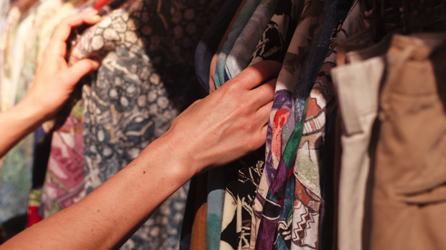 Woman browsing clothes at market