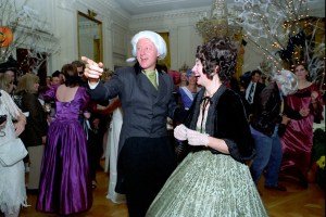 President William Clinton and First Lady Hillary Clinton dressed up as President and First Lady James and Dolley Madison for a Halloween party in the East Room of the White House.