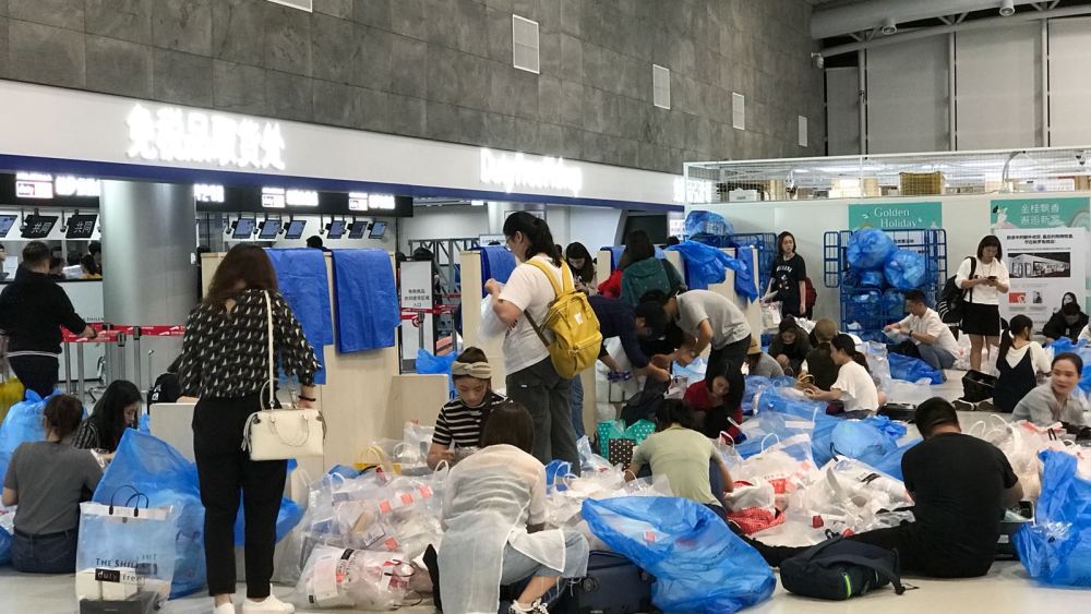 Inside the Jeju airport in South Korea, a designated “repackaging area” where many Mainland Chinese rip open their duty free purchases and take off their packaging. Jeju is a 90 minute flight from Shanghai and a key destination for daigou sellers.