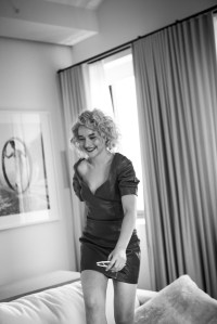 Julia Garner in Area’s lambskin leather dress. Adam Selman x Le Specs sunglasses.