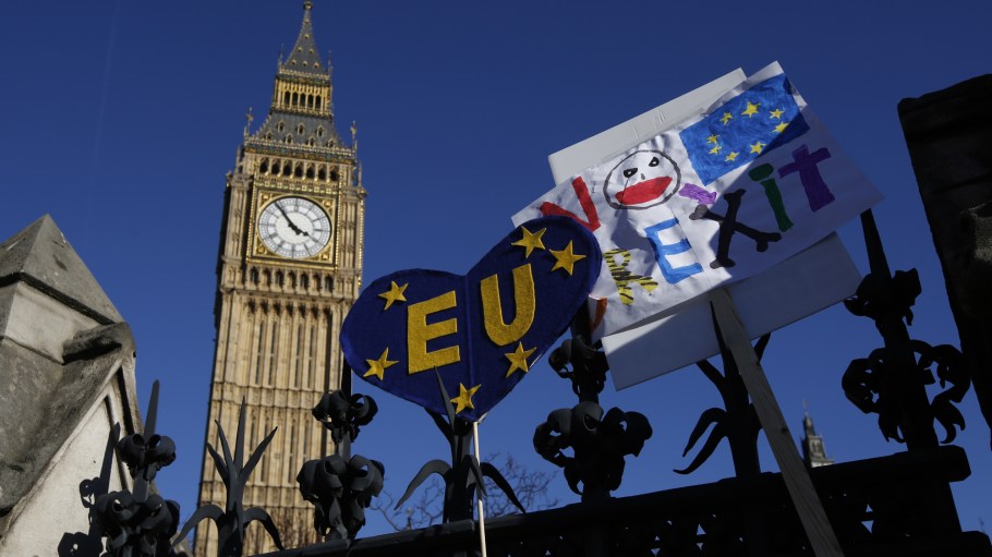 Pro-EU slogans and banners rest on the perimeter fence of the Houses of Parliament