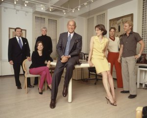Designer Ocar de la Renta in his office at 550 Seventh Avenue with staffers.