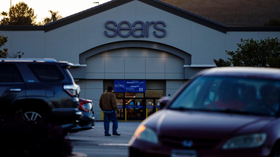 Pedestrians walk outside of a Sears Holdings Corp. store.