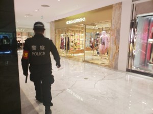 A police officer stands guard outside the Dolce & Gabbana store in SKP Beijing.