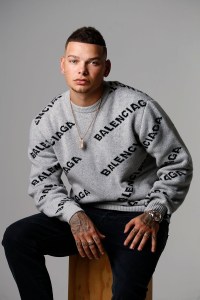 Balenciaga’s sweater, available at mrporter.com, and Mother Denim’s denim jeans.