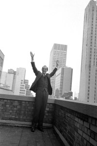 Fashion designer Oscar de la Renta standing on the rooftop of his office building in New York