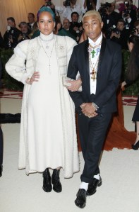Pharrell Williams and Helen Lasichanh at the Metropolitan Museum of Art's Costume Institute Benefit celebrating the opening of Heavenly Bodies: Fashion and the Catholic Imagination in New York, 2018