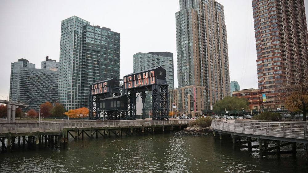 A former dock facility is shown with old transfer bridges, with "Long Island" painted in large letters at Gantry State Park in the Long Island City section of Queens, N.Y., in New York. Amazon announced Tuesday it has selected the Queens neighborhood as one of two sites for its headquartersAmazon HQ Long Island City, New York, USA - 13 Nov 2018